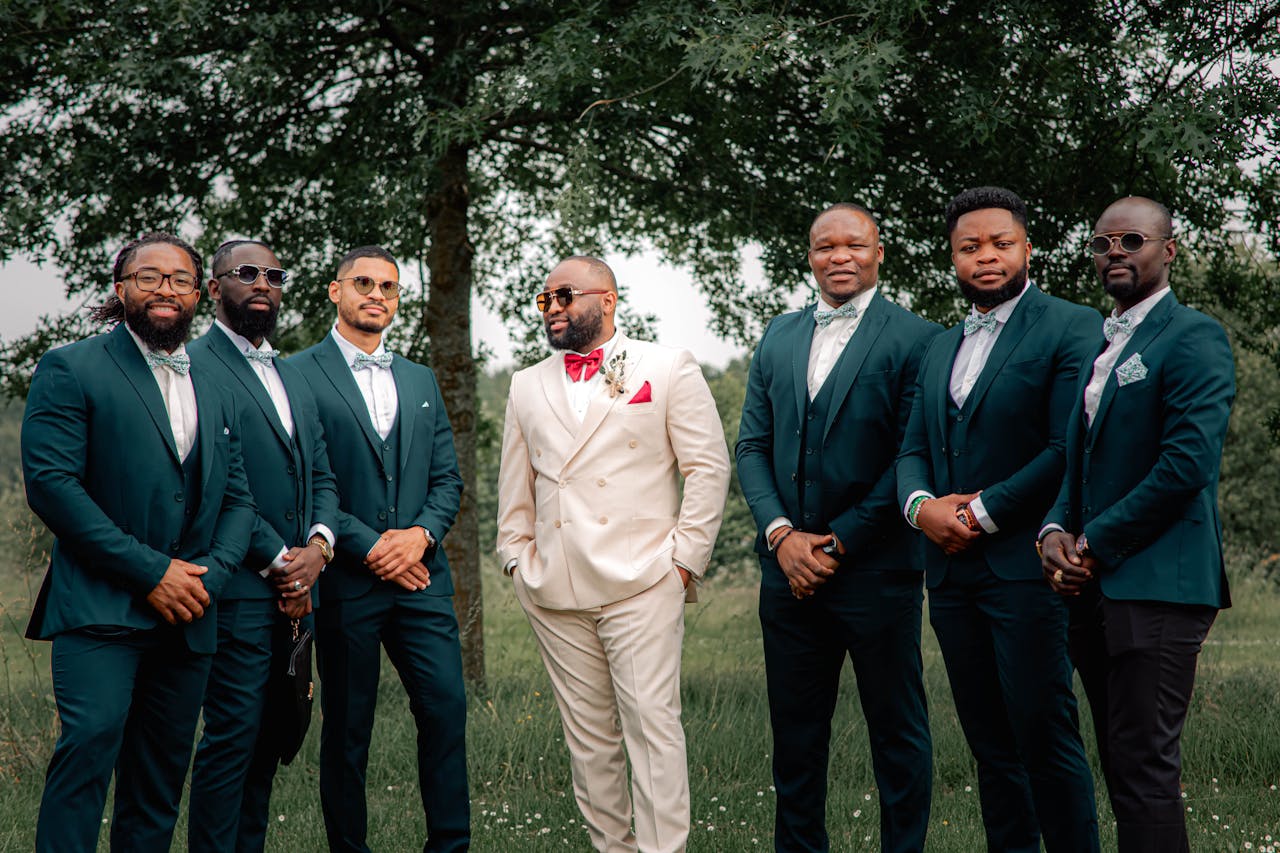 Groom wearing different color of suit from groomsmen to stand out.