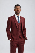 Man wearing a Men's Burgundy Slim Fit Suit three-pieces with white shirt and floral tie, formal attire