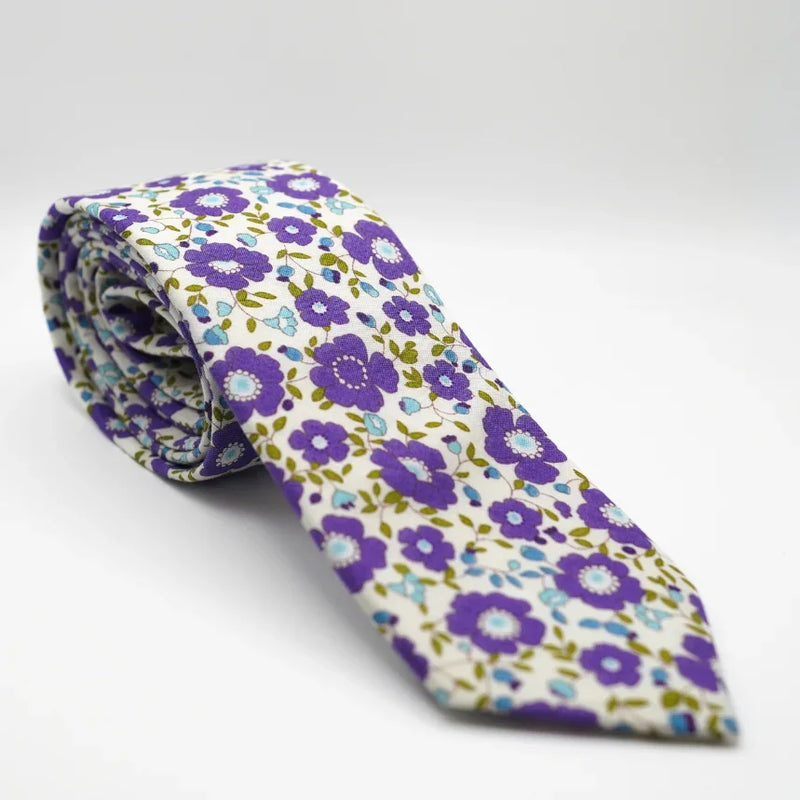 White Purple Meadow Floral Neck Tie is a purple and blue floral tie, wedding or prom accessory, rolled on white background