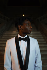 Men's White Slim Fit Tuxedo Jacket & Black Pants. Men's black shawl collar white tuxedo jacket and black slim fit suit pant with performance stretch, delivering comfort and mobility without sacrificing form. The included dress shirt provides everything needed for polished, head-to-toe sophistication at any event.
